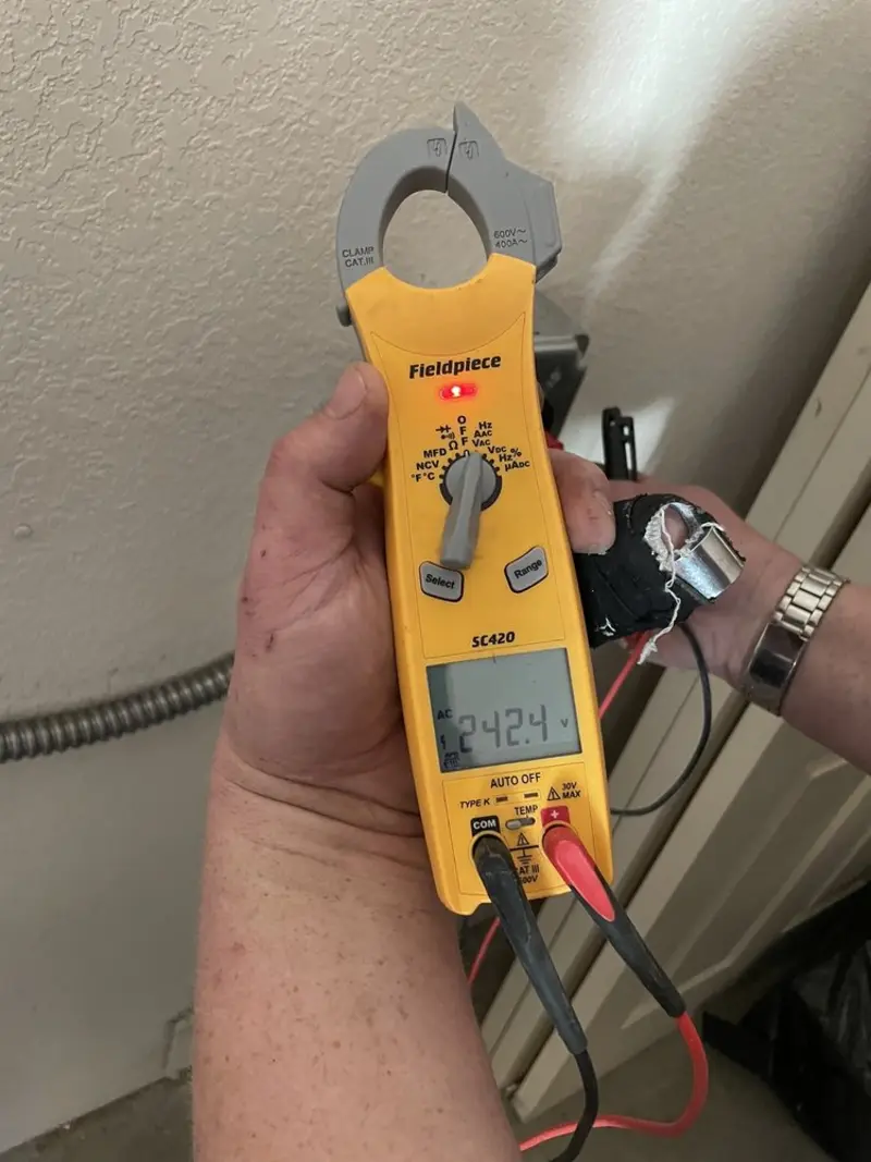 Voltage testing with clamp meter during Generator Installation in Palm Springs